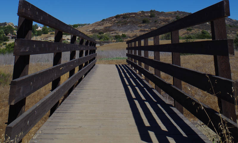 across the wooden bridge